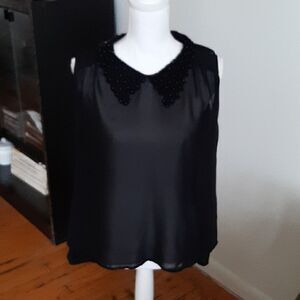 Nikki Rich black sleeveless top